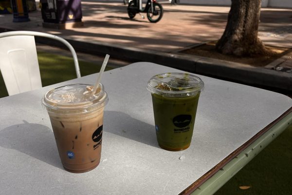 A ubeng ube latte and mango matcha latte sit on a table. Ube is a vibrant purple yam originally from the Philippines, known for its sweet, nutty and vanilla-pistachio flavor, and is widely used in Filipino desserts. However, Boondocks Coffee Roasters uses ube extract as a base in many of their Filipino-inspired matcha and coffee drinks.