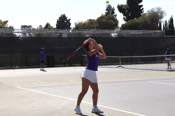 Prepping for a serve, Elle Spiegel ('30) gets ready to hit to her opponent. Ava Gabor ('32) said being in the right mindset is especially crucial for serves because they are the first ball that gets put into play. "It's really important to lift yourself back up when you get stressed," Gabor said, “because I guarantee if you play tennis, you will be down, but you just have to keep going.”
