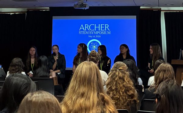 Seniors Josie White, Finley Vincent, Melinda Wang, Evan Weingarten and Skylar Roberts and junior Katia Thomas answer questions and give advice at the Q&A panel. The STEM symposium, an event to recognize and empower students' scientific accomplishments and hard work, was held on Thursday, May 14, in the library and was a day filled with science and camaraderie. Organizer Hanna Robertson said that, to further encourage girls to pursue STEM, a panel was added to the day's agenda.  “Students get to talk about their experiences and challenges and what they’ve learned,” Robertson said. “For students that might be interested in potentially pursuing that or don’t really know what it’s like or what opportunities are available for them, they can learn more about it through the panel.”