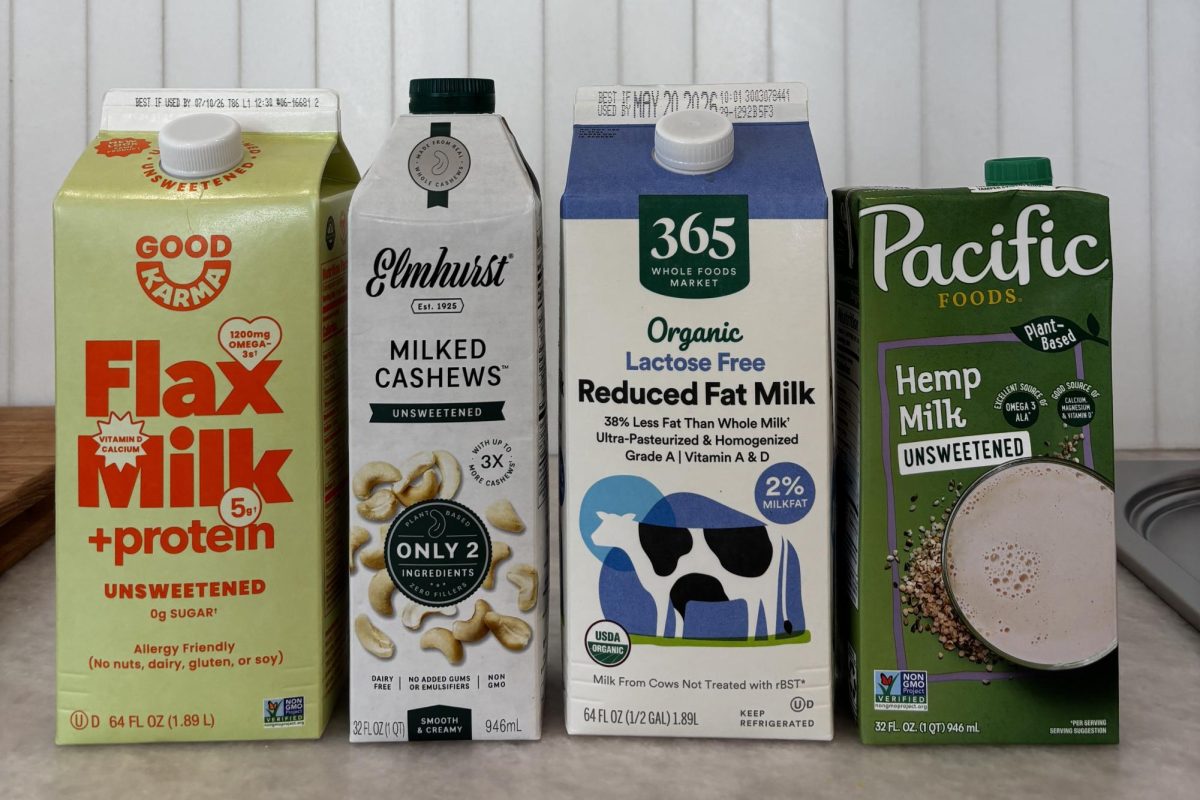 Different types of milks, such as cow milk and hemp milk sit on a kitchen counter. Plant based milks are more sustainable than cow's milk because they don't release as much greenhouse gases into the atmosphere and use less land. There are many different types of plant based milks — each with different positive and negative factors.