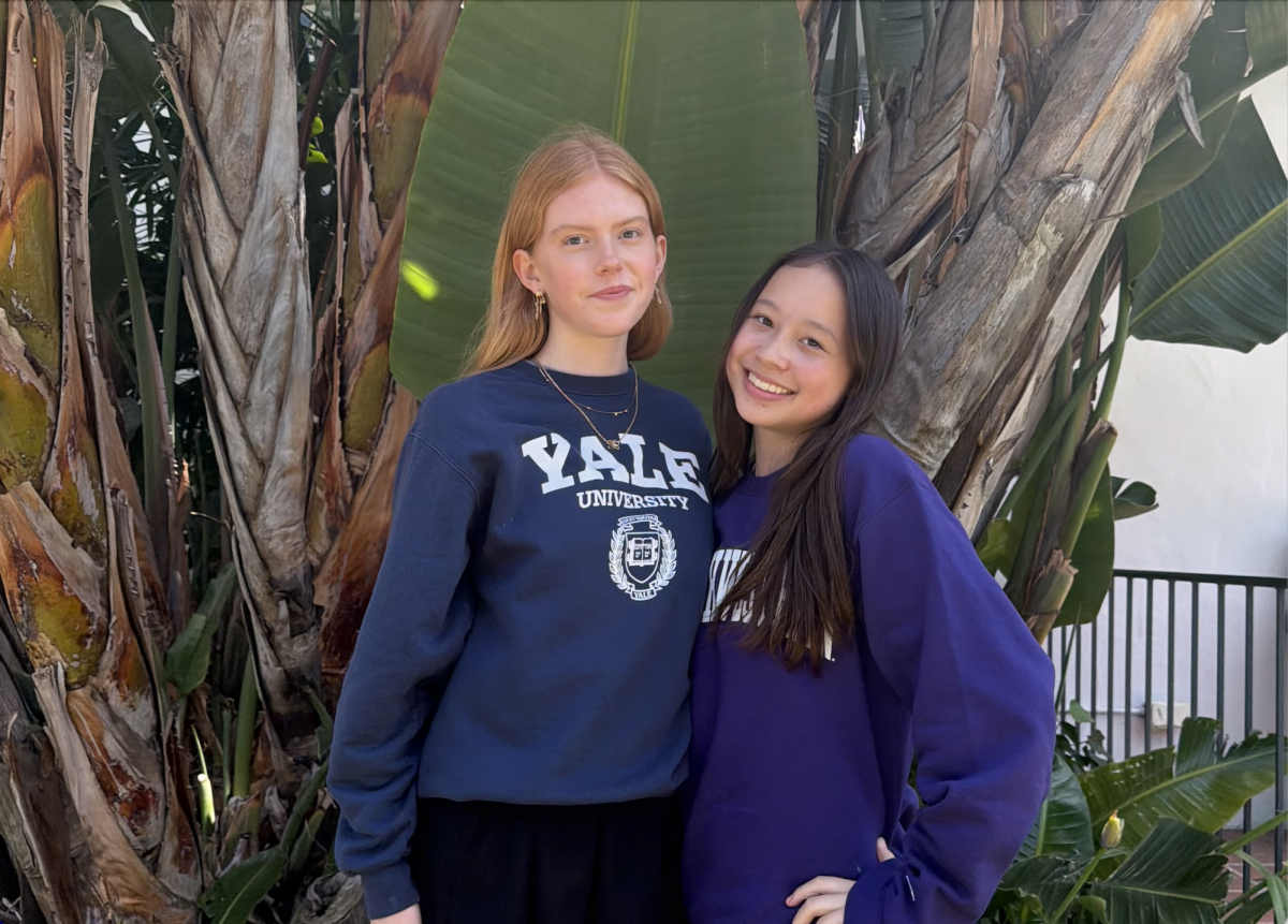 Co-Editors-in-Chief Oona Seppala ('26) and Emily Paschall ('26) pose for a picture during Archer's college commitment celebration May 1. As graduation nears, the two reflected on their purpose leading The Oracle over the last year. (Photo courtesy of Allegra Carney)