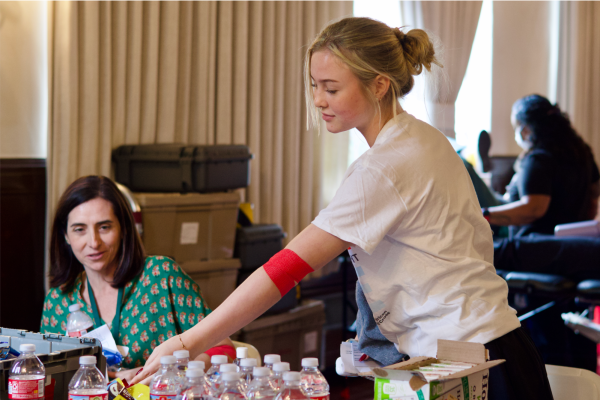 After donating blood during Archer's annual blood drive, Bonnie Van Hoytema ('28) reaches for a bottle of water and a chocolate bar. Donors are given sugary snacks and fluids to help their bodies recover following the procedure. The campus event brought together students, faculty and staff in an effort to address ongoing blood shortages. "I donated because I want to make an impact for others," Van Hoytema said. "Our youth really drives activism, and I want to take advantage of opportunities like this to help."